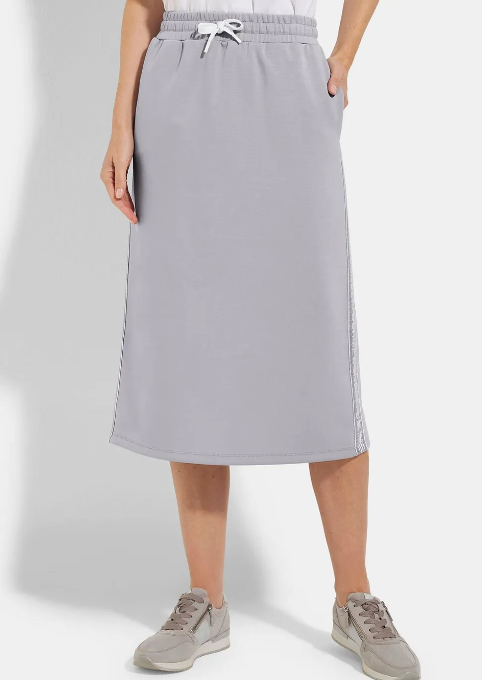 Jupe en sweat avec lien de serrage sous coulisse. En coton et élasthanne.