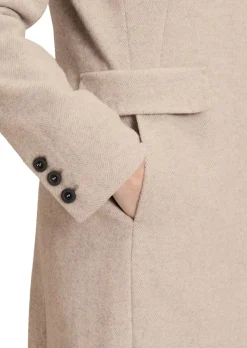 Manteau laineux avec motif à chevrons
