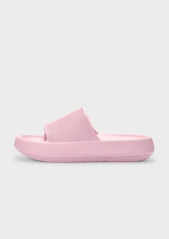 Mules de bain avec semelle extérieure à surface structurée pour une meilleure accroche.