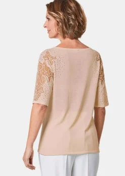 Pull avec empiècements en dentelle et pierres scintillantes