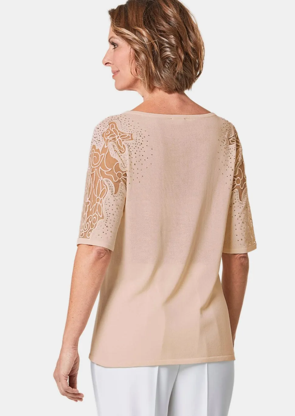 Pull avec empiècements en dentelle et pierres scintillantes