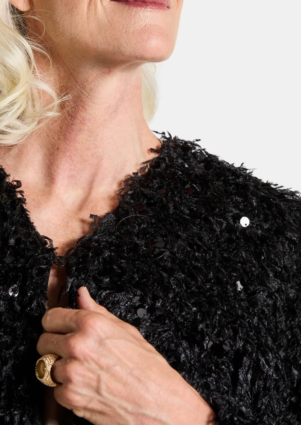 Veste aspect plumes, orné de paillettes